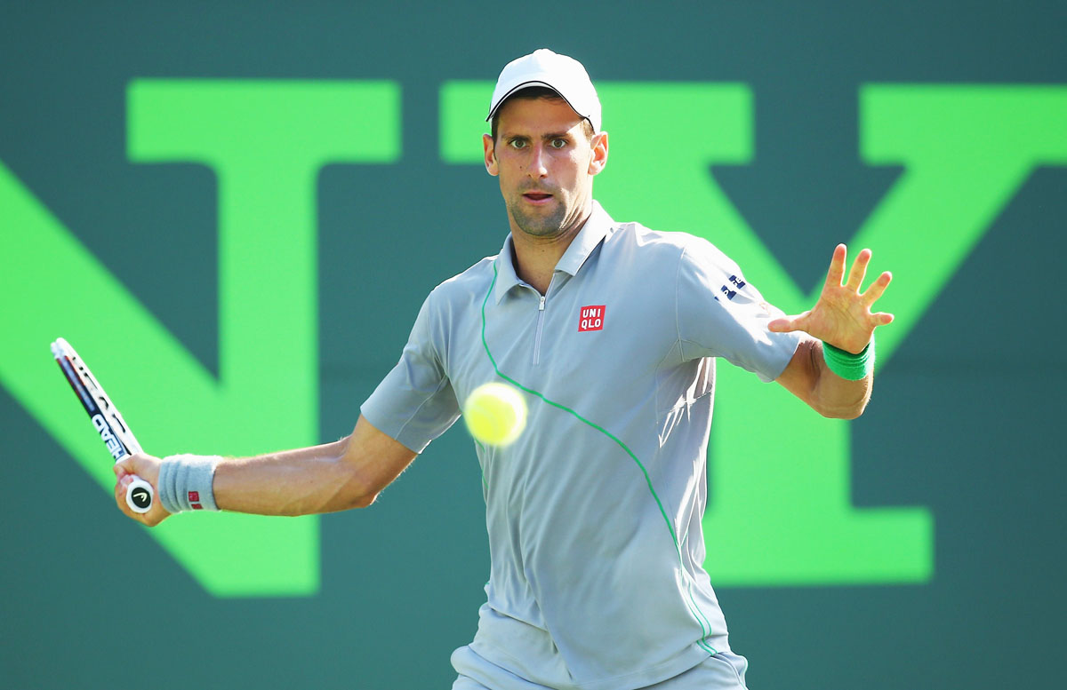 novak djokovic of serbia hits the ball back to jeremy chardy of france during their match on day 5 of the sony open at crandon park tennis center on march 21 2014 in key biscayne florida photo afp