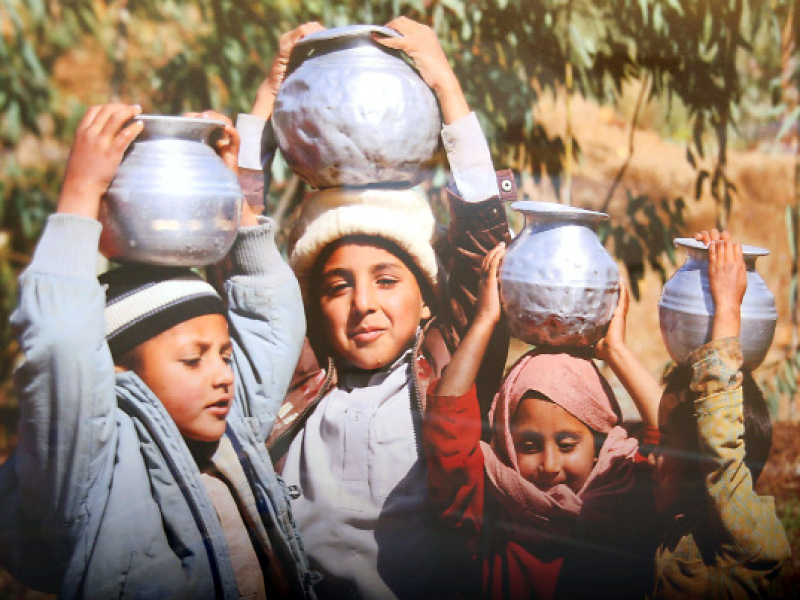 several pictures featured children with vessels to carry pump water photo abid nawaz express