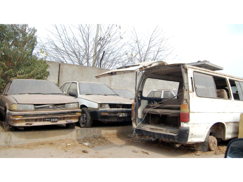 vehicles parked on the roadside have been waiting for clearance for years photo muhammad javaid express