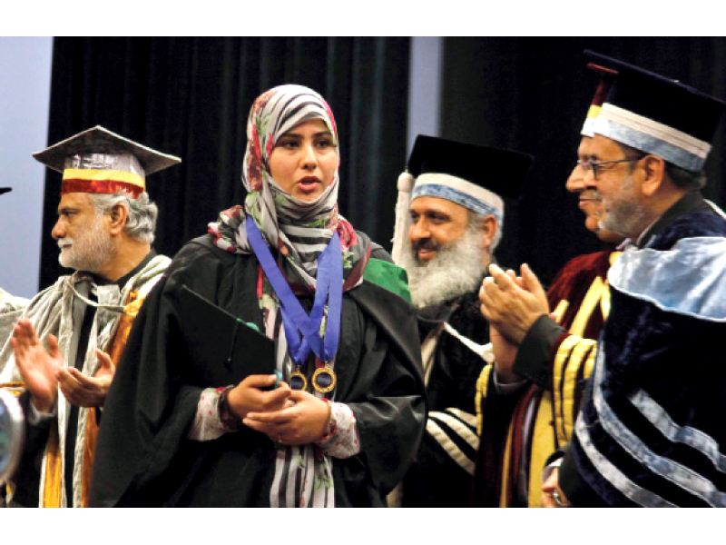 a student receiving her medals at the convocation photo muhammad javaid express