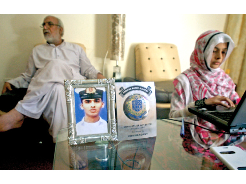 father and wife of second officer mehdi shamsi wait for his return shamsi is to be handed over the libyan authorities and may be tried for assisting the rebels who held him at gunpoint photo athar khan express