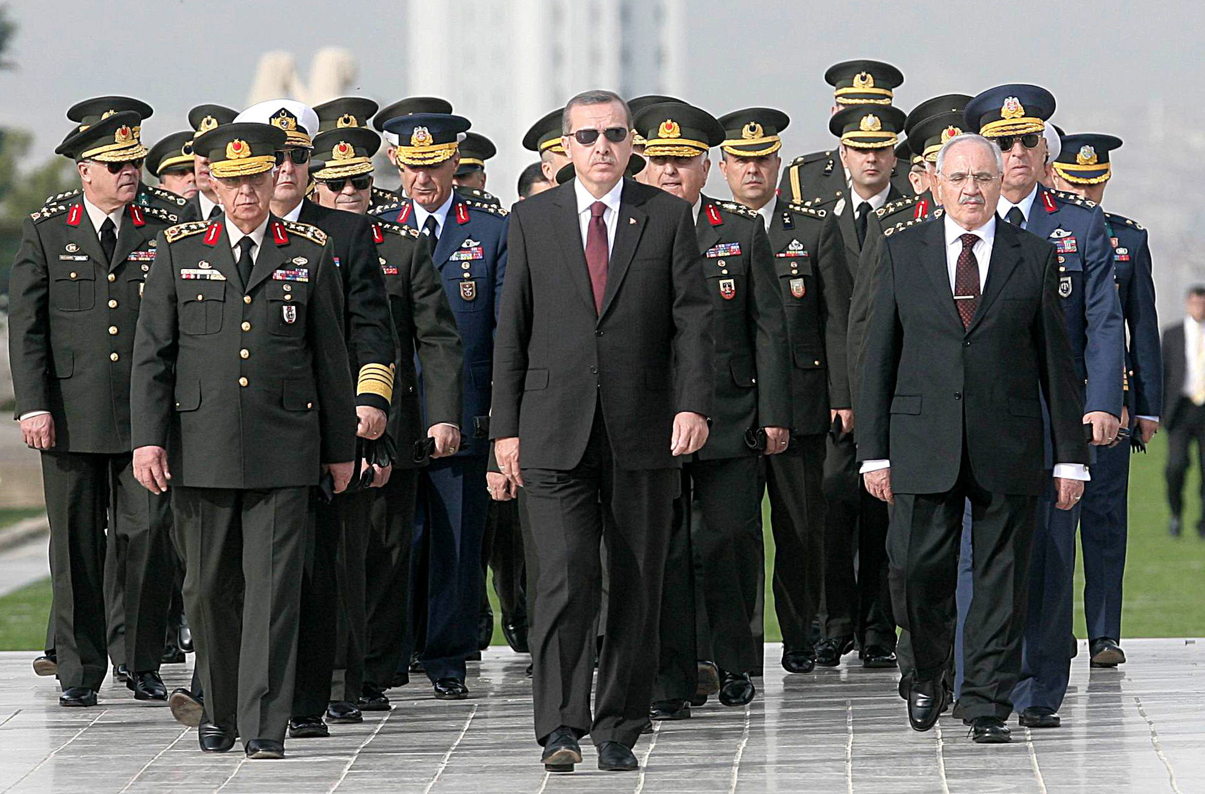 a file photo from 2010 shows prime minister recep tayyip erdogan c attending a wreath laying ceremony with members of the supreme military council at the mausoleum of mustafa kemal ataturk erdogan on march 23 2014 congratulated the military for downing a syrian warplane near its border photo afp file