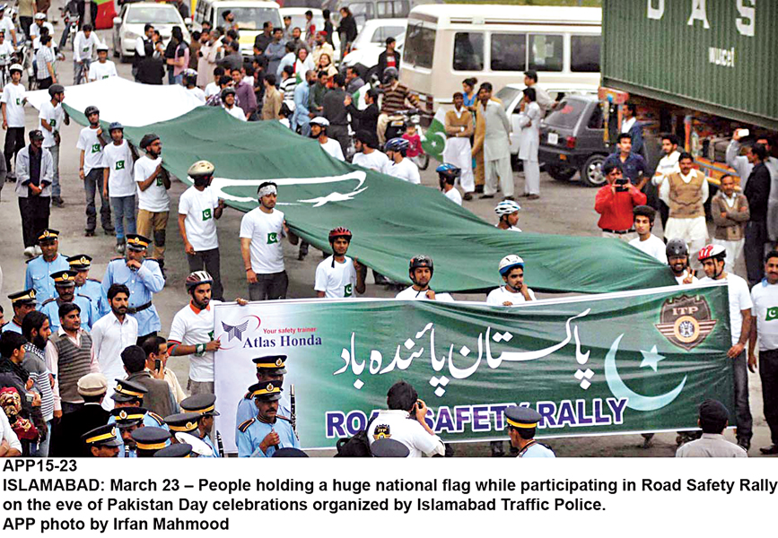 a road safety rally with a long national flag by youngsters top a cycle rally left and a crafts exhibition right were some of the features of several events held in islamabad on pakistan day photos express inp app