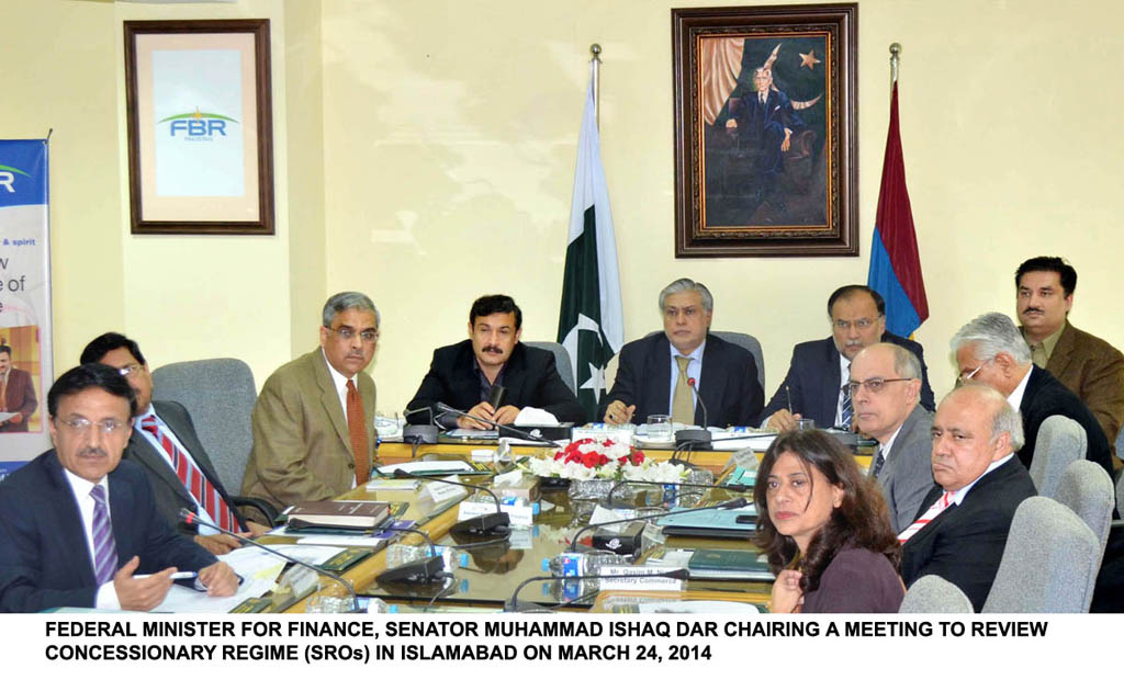 finance minister ishaq dar c chairing a meeting to review sros in islamabad on march 24 2014 photo pid