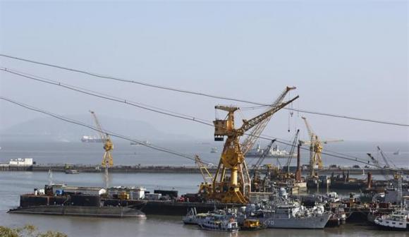 ships and submarines belonging to the indian navy are seen docked at the naval dockyard in mumbai february 27 2014 photo reuters