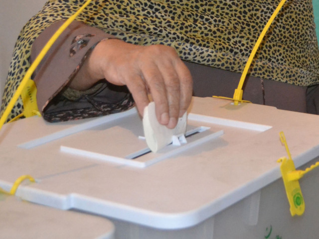 file photo of a woman casting her ballot for the local bodies elections in quetta on december 7 2013 photo afp file photo of a woman casting her ballot for the local bodies elections in quetta on december 7 2013 photo afp