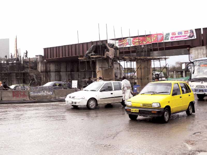 workers setting up a platform along the metro bus route photo agha mehroz express