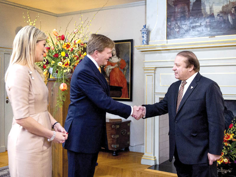 dutch king willem alexander and queen maxima greet prime minister nawaz sharif at the royal palace in the hague photo afp