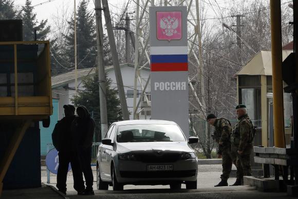 civilians entering ukraine have their passports checked photo reuters