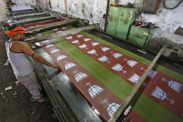 a worker prints the flags of india 039 s main opposition bharatiya janata party bjp in a factory photo reuters a worker prints the flags of india 039 s main opposition bharatiya janata party bjp in a factory photo reuters