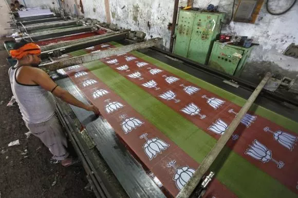 a worker prints the flags of india 039 s main opposition bharatiya janata party bjp in a factory photo reuters a worker prints the flags of india 039 s main opposition bharatiya janata party bjp in a factory photo reuters