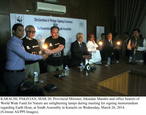 provincial minister sikandar mandhro along with officials of wwf light lamps after signing a memorandum for earth hour on wednesday photo ppi provincial minister sikandar mandhro along with officials of wwf light lamps after signing a memorandum for earth hour on wednesday photo ppi