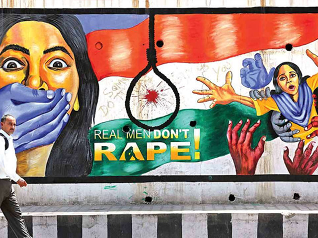 a man walks past a graffiti depicting a message in protest against rape in jammu on sunday photo reuters a man walks past a graffiti depicting a message in protest against rape in jammu on sunday photo reuters
