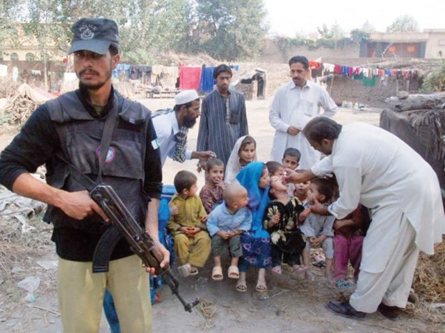 file photo of a police officer guarding a anti polio campaigner file photo of a police officer guarding a anti polio campaigner