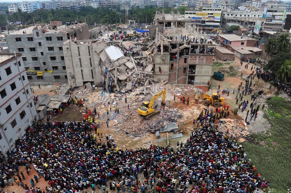 in this photograph taken on april 25 2013 bangladeshi volunteers and rescue workers are pictured at the scene after the rana plaza complex collapsed in savar on the outskirts of dhaka photo afp