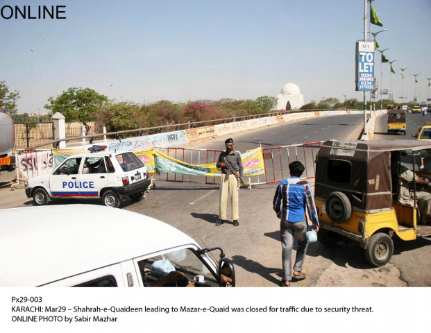 a police official stands guard as the road leading the quaid 039 s mausoleum is closed on saturday photo online a police official stands guard as the road leading the quaid 039 s mausoleum is closed on saturday photo online