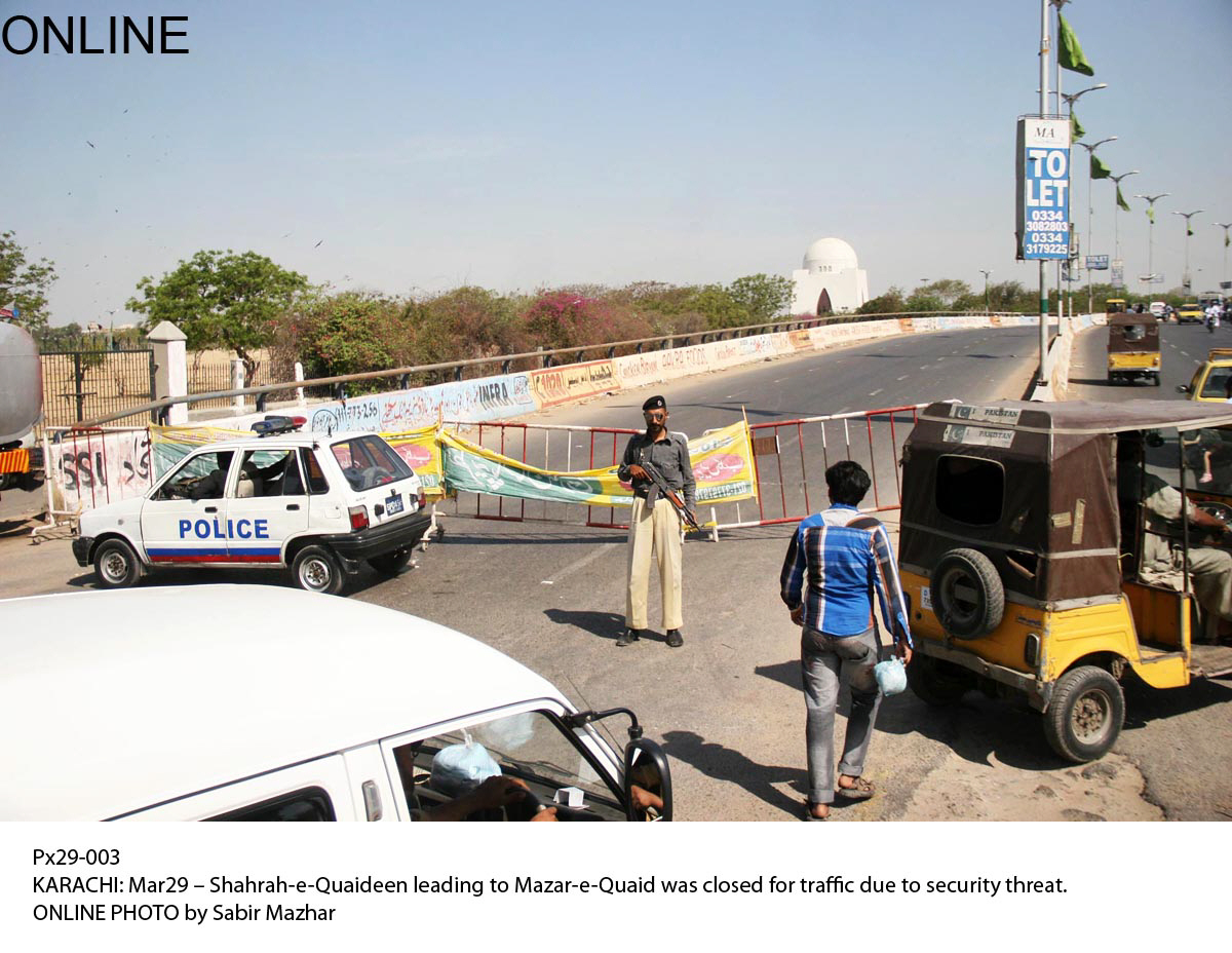 a police official stands guard as the road leading the quaid 039 s mausoleum is closed on saturday photo online