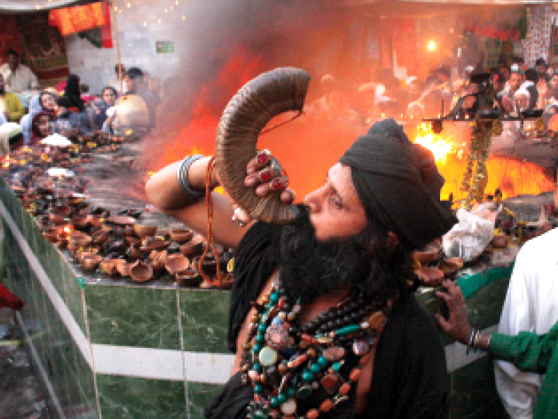 a malang blows a herald horn in front of the alao photo abid nawaz express