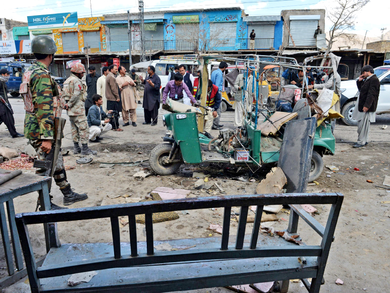 security personnel are seen at the bomb blast site in quetta on saturday photo afp