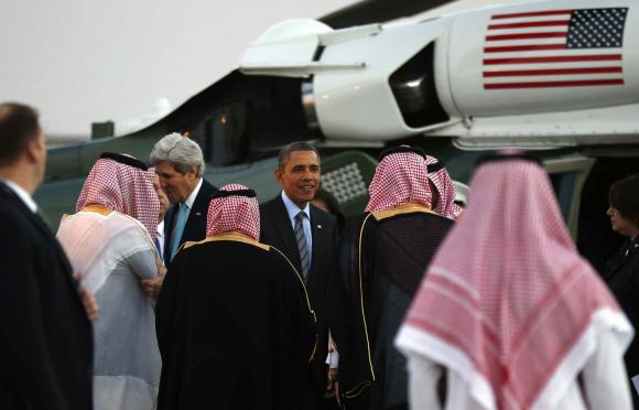 secretary of state john kerry and us president barack obama are greeted upon their arrival in marine one near riyadh photo reuters