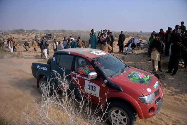 a pakistani jeep drives past spectators during the desert jeep rally in the cholistan desert in drawar photo afp a pakistani jeep drives past spectators during the desert jeep rally in the cholistan desert in drawar photo afp