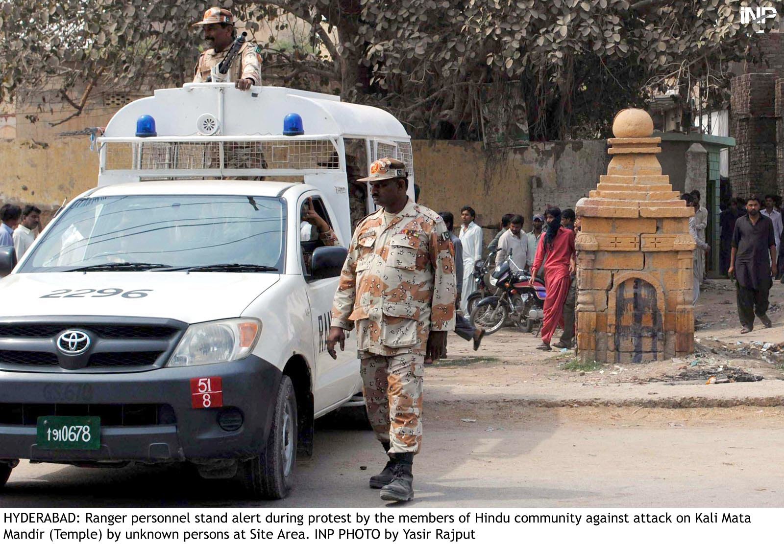 rangers stand guard outside a temple photo inp