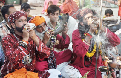 festival of lights thousands visit shah hussain s urs