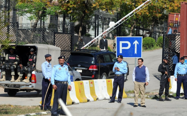 security personnel escort the vehicle c carrying former president pervez musharraf as he arrives at a special court in islamabad on march 31 2014 photo afp security personnel escort the vehicle c carrying former president pervez musharraf as he arrives at a special court in islamabad on march 31 2014 photo afp