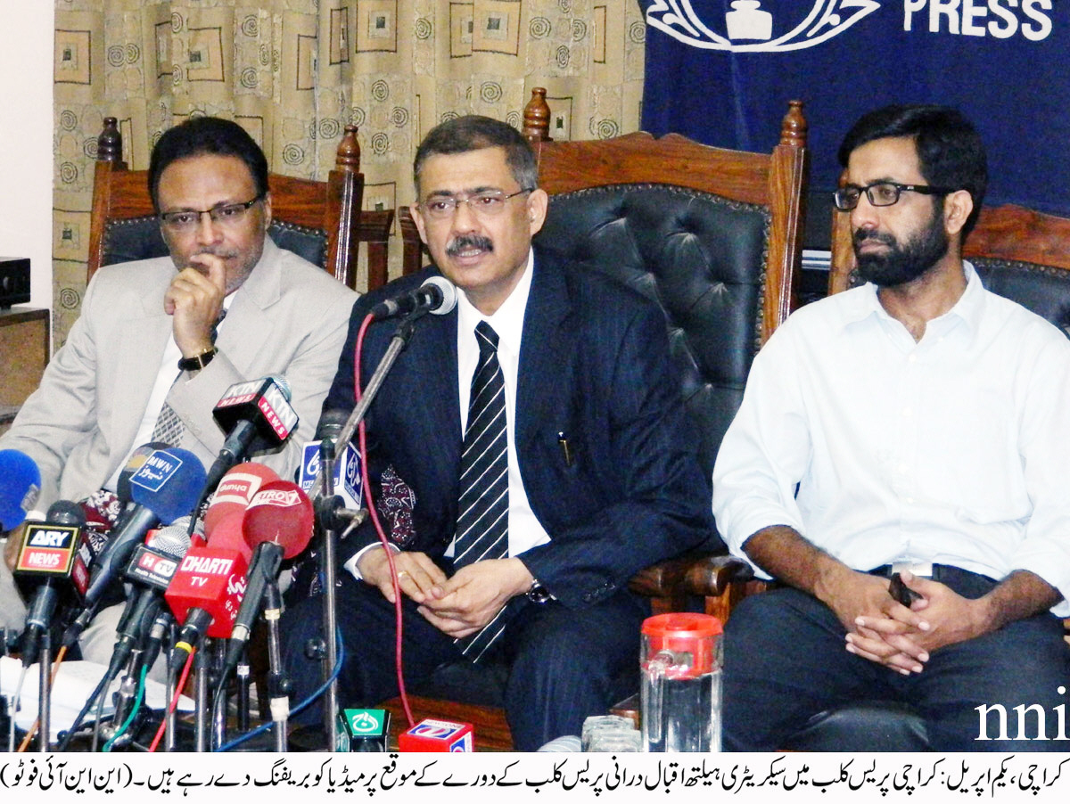 health secretary iqbal durrani addressing a press conference at the karachi press club on tuesday photo nni