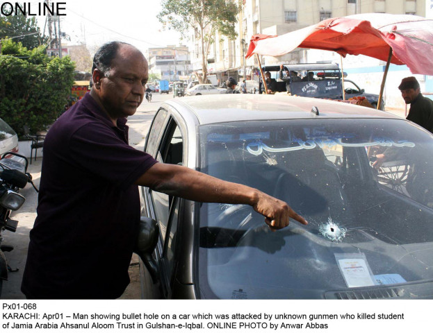 a man points to the bullet holes in the car that was attacked in gulshan on tuesday the attack killed a student of jamia arabia ahsanul aloom photo online a man points to the bullet holes in the car that was attacked in gulshan on tuesday the attack killed a student of jamia arabia ahsanul aloom photo online