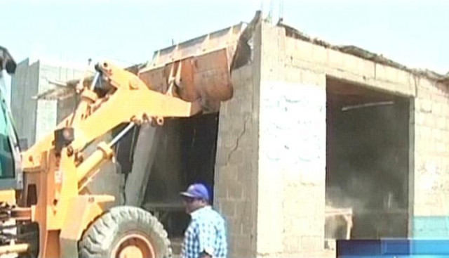 express news screengrab shows kmc 039 s demolition operation in chakra goth area of karachi on april 2 2014 express news screengrab shows kmc 039 s demolition operation in chakra goth area of karachi on april 2 2014