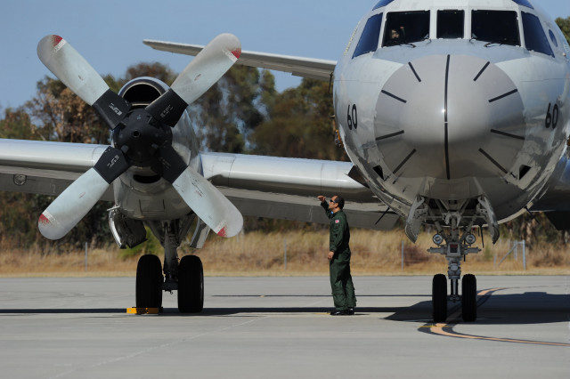 a ground crew member inspects a japan orion aircraft prior to it leaving pearce airbase in bullsbrook to continue searching for missing malaysia airlines flight mh370 photo afp a ground crew member inspects a japan orion aircraft prior to it leaving pearce airbase in bullsbrook to continue searching for missing malaysia airlines flight mh370 photo afp