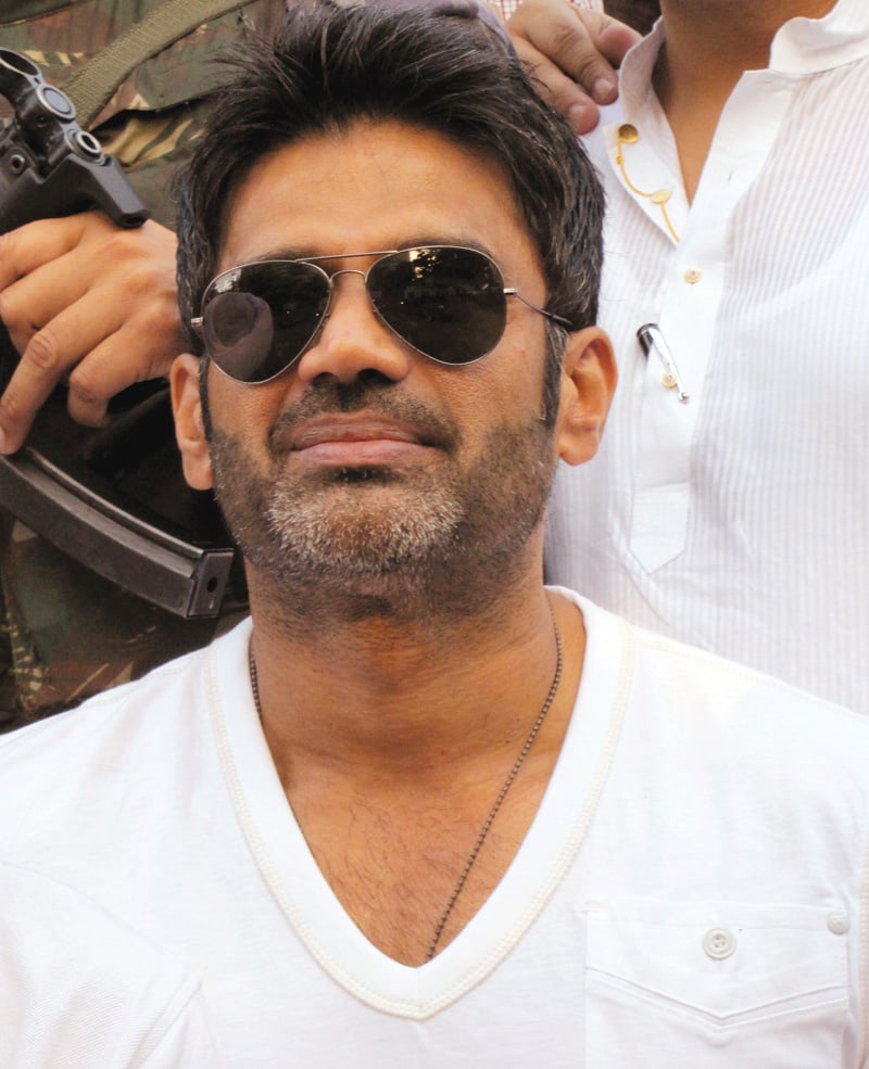 a delhi court imposed a fine of inr20 000 on bollywood actor suniel shetty after he failed to appear before it in a defamation case