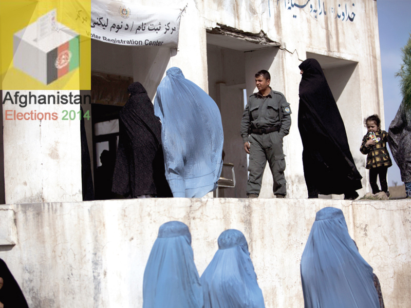 afghan residents queue to receive their voter cards for the upcoming presidential election at a voter registration centre in herat on march 31 2014 photo afp