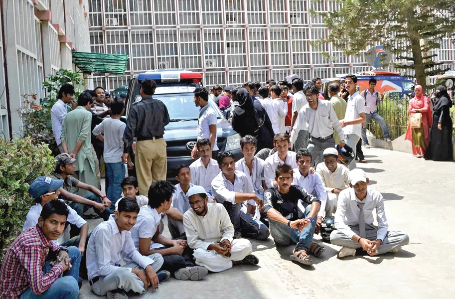students whose exam forms were not submitted by their schools protest outside the board s premises on wednesday photo muhammad azeem express