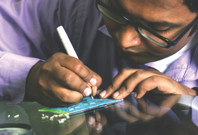waseem raheem a miniature artist can paint the flags of 55 countries on a needle below another artist mirza adeel above can inscribe 52 alphabets on a grain of rice these micro artists have become quite popular in a short period of time due to their talents photos athar khan express waseem raheem a miniature artist can paint the flags of 55 countries on a needle below another artist mirza adeel above can inscribe 52 alphabets on a grain of rice these micro artists have become quite popular in a short period of time due to their talents photos athar khan express