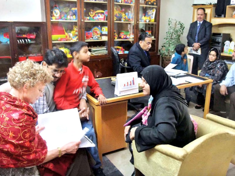 parents discussing autism issue of their child with a visiting british expert at centre for profound education in rawalpindi on the occasion of world autism day photo app