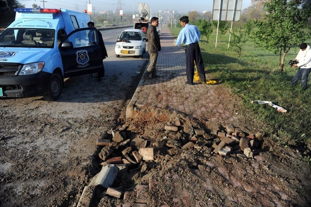policemen inspect the site of a bomb explosion in islamabad on april 3 2014 the bomb was planted on musharraf 039 s route from an army hospital where he has been staying since january to his home on the outskirts of islamabad photo afp policemen inspect the site of a bomb explosion in islamabad on april 3 2014 the bomb was planted on musharraf 039 s route from an army hospital where he has been staying since january to his home on the outskirts of islamabad photo afp