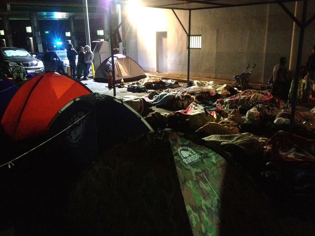 residents who have fled their homes sleep on an open street in iquique chile after a powerful earthquake measuring 7 8 rocked northern chile late april 3 2014 the day after a deadly 8 2 jolt in the same region authorities said photo afp