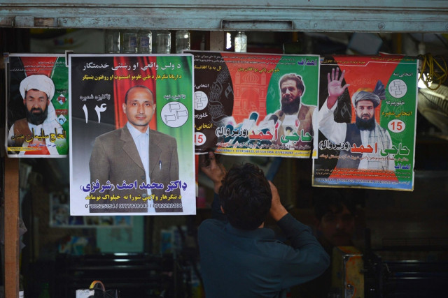 electoral posters of afghan presidential candidates at a printing press in peshawar photo afp electoral posters of afghan presidential candidates at a printing press in peshawar photo afp