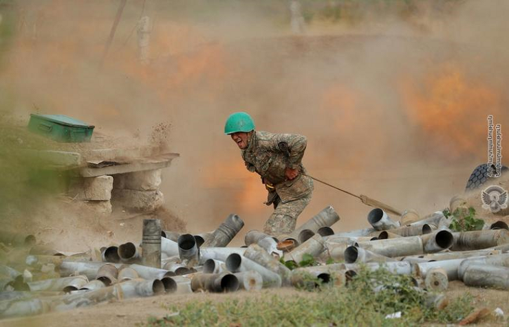 An ethnic Armenian soldier fires an artillery piece during fighting with Azerbaijan's forces in the breakaway region of Nagorno-Karabakh, September 29. PHOTO: REUTERS