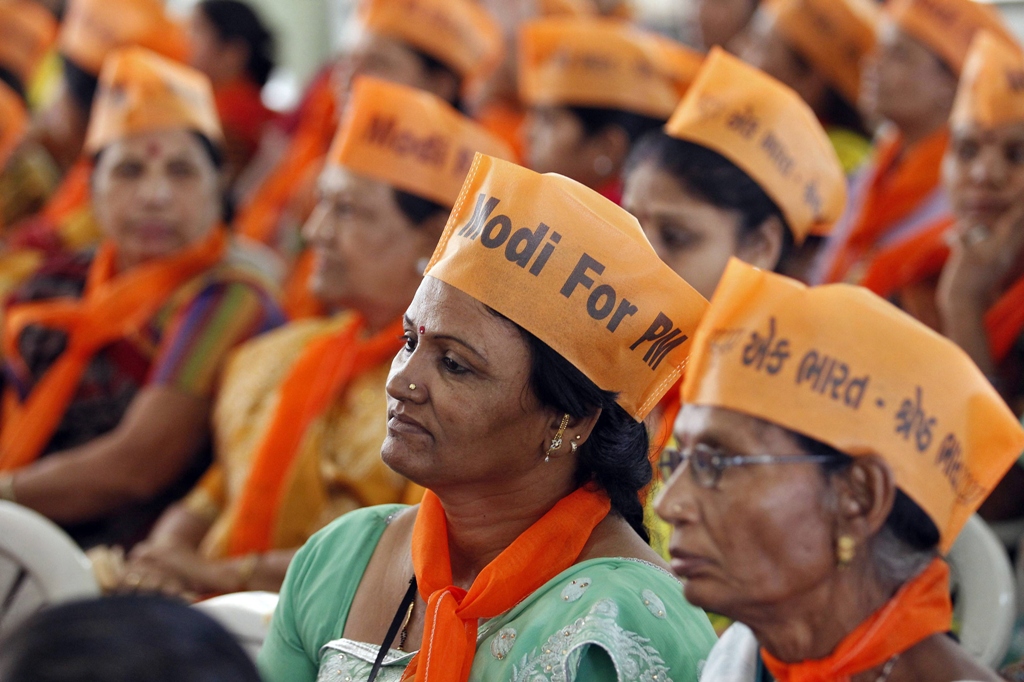 workers of india 039 s main opposition bharatiya janata party bjp await the arrival of bjp leader lal krishna advani and bjp prime ministerial candidate narendra modi at a workers 039 party meeting ahead of the general election at gandhinagar in the western indian state of gujarat photo reuters