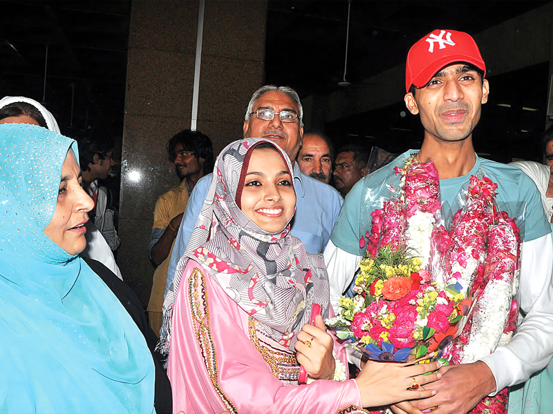 relatives greet mehdi shamsi second officer of morning glory at karachi airport photo app