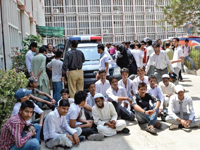 students whose exam forms were not submitted by their schools protest outside the board s premises on wednesday photo muhammad azeem express