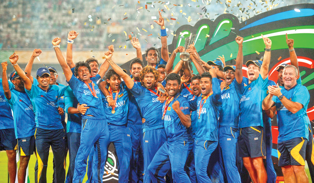 sri lankan cricketers pose with the tournament trophy after victory over india in the icc world twenty20 final photo afp