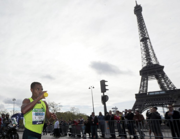 ethiopia 039 s runner kenenisa bekele runs past the eiffel tower as he competes during the 38th paris marathon on april 6 2014 in paris photo afp ethiopia 039 s runner kenenisa bekele runs past the eiffel tower as he competes during the 38th paris marathon on april 6 2014 in paris photo afp