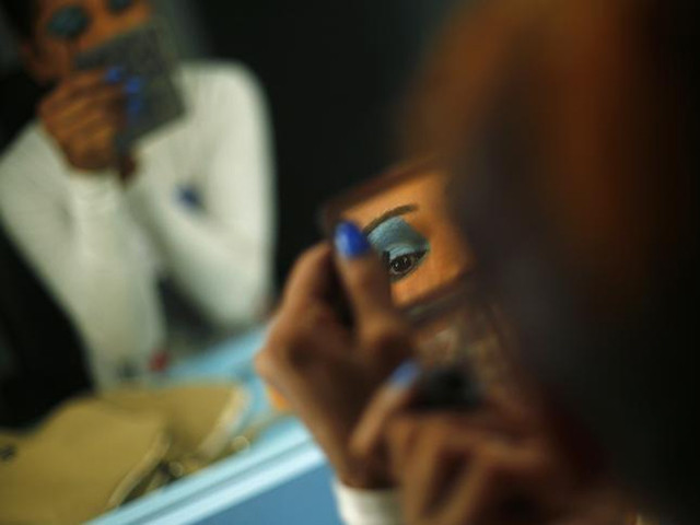 an aspiring model does her make up before auditioning for a transgender transsexual modelling agency set to open in new delhi february 7 2016 photo reuters