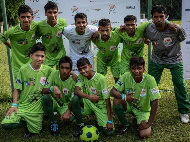 pakistani players pose for photographers before the match against india during the second edition of the street child world cup in rio de janeiro brazil on april 1 2014 photo afp file