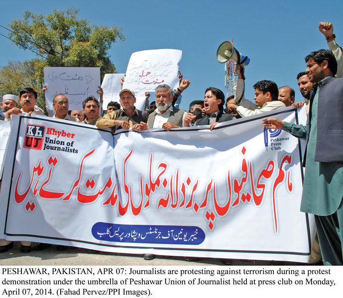 journalists protest under the umbrella of peshawar union of journalists at the press club photo ppi