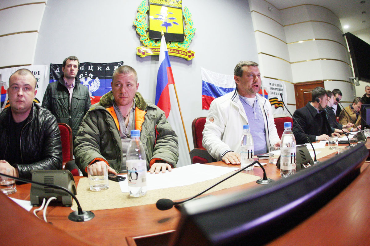 pro russian activists who seized the main administration building in the eastern ukrainian city of donetsk take part in a meeting on april 7 2014 in donetsk photo afp